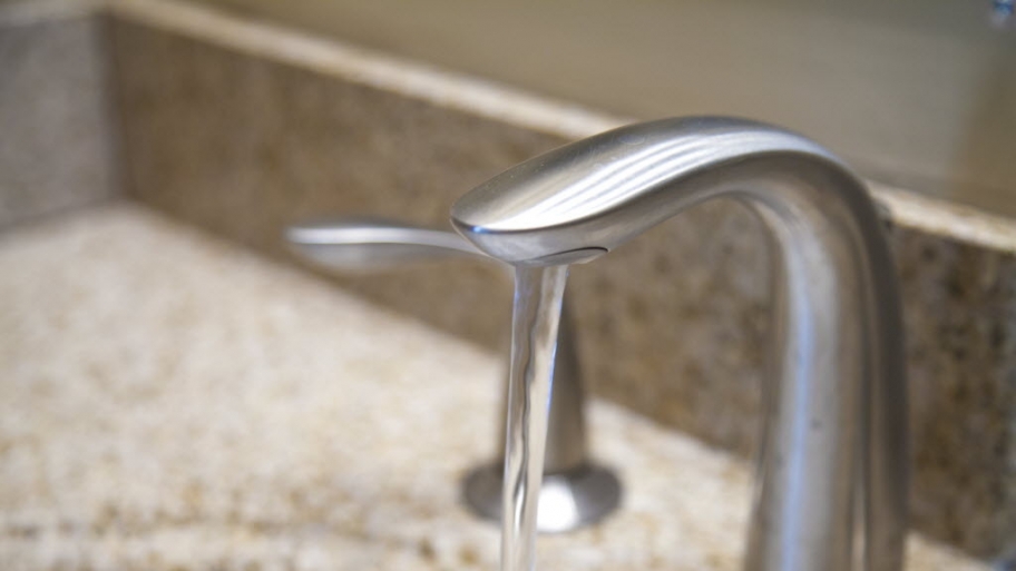 Water faucet running